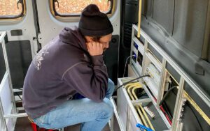 Jurrien sits in the van contemplating the electrical wiring. Not all van build days are great.